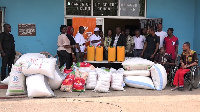 GOIL's brand ambassador, Azumah Nelson making the presentation to the Teshie Orphanage