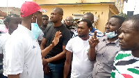 Asawase MP Muntaka Mubarak with some of the NDC supporters at the police station