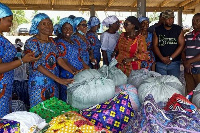 Dzifa Gomashie making a donation to victims of the tidal waves destruction