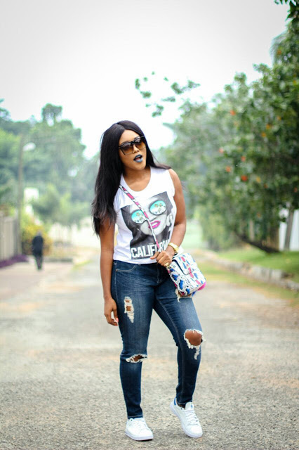 AkosuaVee in 'destroyed' demin jeans