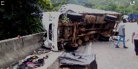 The truck somersaulted and crashed at the side of the road