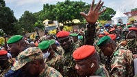 Lieutenant Colonel Mamady Doumbouya waves to the crowd in Conakry