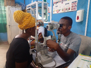 A woman getting her eyes checked