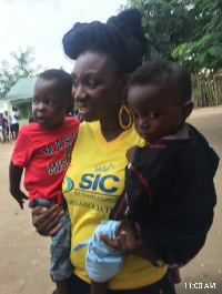 SIC Ladies Association president poses with some of the children of the orphanage