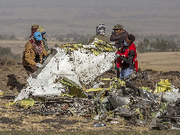 Rescuers work at the scene of an Ethiopian Airlines flight crash outside of Addis Ababa, Ethiopia.