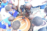 Some students building a robot