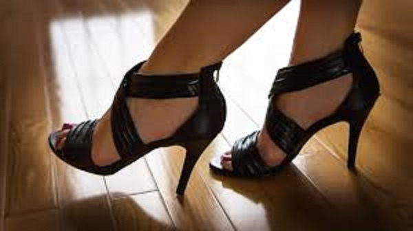 The writer says wearing high heels for long usually causes disabilities in women