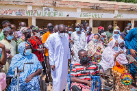 Alban Bagbin standing by some beneficiaries