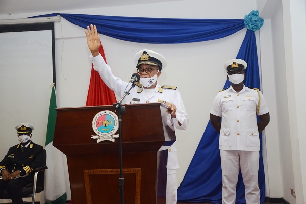 Rear Adm Moses Beick-Baffour conferring the JSC on the graduands