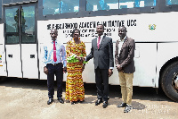 Minister Osei Adutwum (second right) hands over the bus to UCC officials