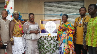 Nana Adwoa Korantiwaa II presenting the items to the beneficiaries