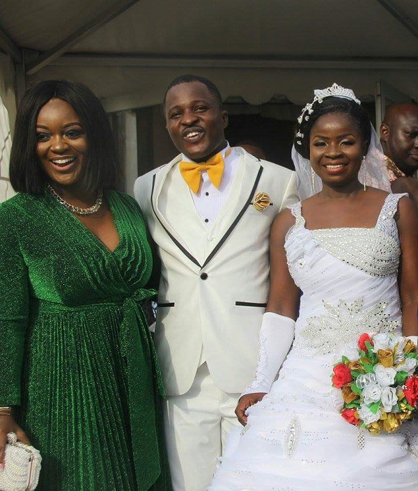 Actress Jackie Appiah with bride and groom