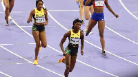 Despite a valiant effort, Andrenette Knight dropped the baton after contact with an Irish athlete