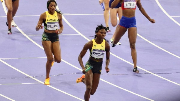 Despite a valiant effort, Andrenette Knight dropped the baton after contact with an Irish athlete