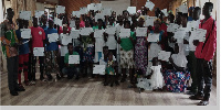 Beneficiaries displaying their certificates