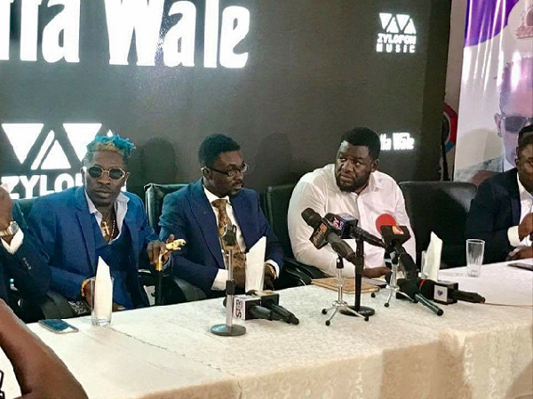 Shatta Wale [L]; CEO of Zylofon Media, Nana Appiah Mensah [M] and Bulldog [R] at the unveiling