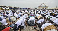 Some Muslims praying at the Black Star square