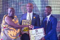 Mr. Clement Effah, Managing Director of Clemonic Company (M) receiving the best award from Nana Prah