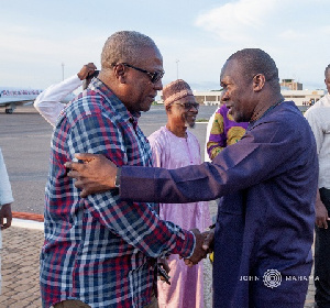 Former  President John Dramani Mahama in a handshake with Alban Bagbin