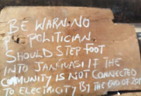 Local sign post warning politicians not to step their feet in the Janguasi to campaign