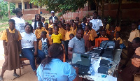 Some officials with pupils of Yonguase M/A Basic School