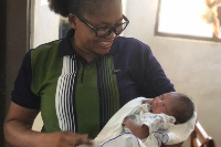 A Police officer with the abandoned baby