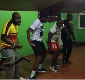 Asamoah Gyan (In white) with some colleagyes dancing to DJ Cuppy