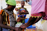 A child being examined in Burkina Faso