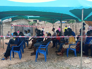 Some residents seated and waiting for their turn to register