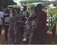 Linda Akweley Obenewaa Ocloo presenting tricycles to various wards  in her constituency