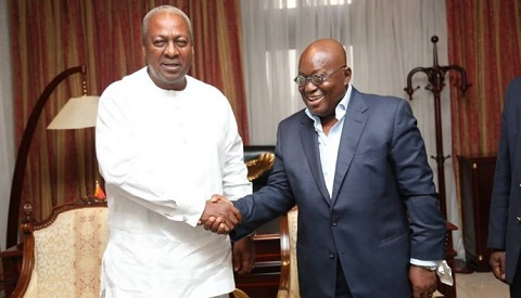 President Nana Addo Dankwa Akufo-Addo in a handshake with Former President John Dramani Mahama