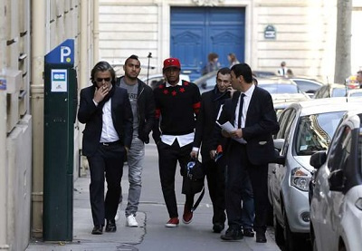 Dede Ayew and Dmitri Payet with some football officials