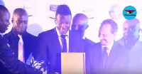 Asamoah Gyan receiving his award from the Italian Ambassador to Ghana