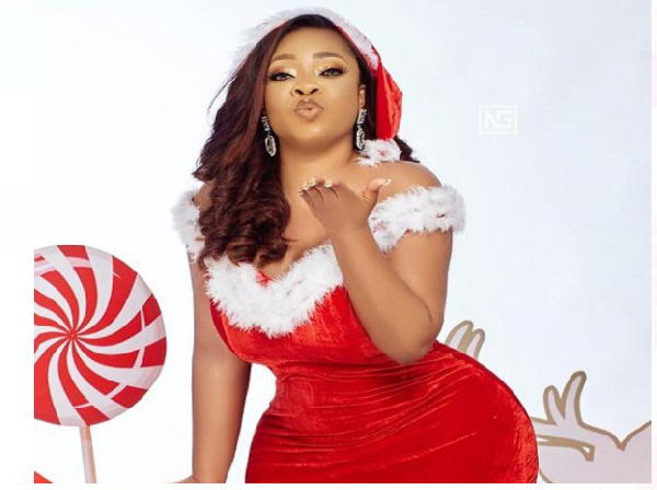 Moesha Boudong clad in a Christmas-themed outfit