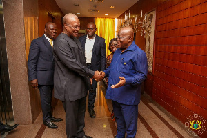 Former President Mahama in a handshake with President Akufo-Addo