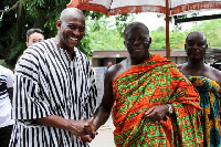 Herbert Mensah in a handshake with Otumfuo