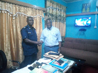 DSP Thomas Bayor in a handshake with Emmanuel Armah Kofi-Buah, MP Ellembelle Constituency