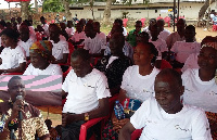 Section of Cocoa farmers of Kookoo-Pa. INSET: Nana Asare Bediako