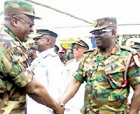 Former President John Mahama exchanges pleasantries with Major General Sampson Adeti