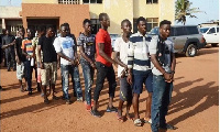 Some of the 14 persons indicted to stand trial for the murder of the military officer