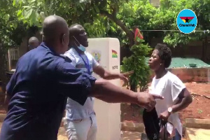 The lady in question being led out of the polling centre by a security officer and another delegate