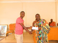 Togbe Kotoku XI presented the cash to the beneficiaries