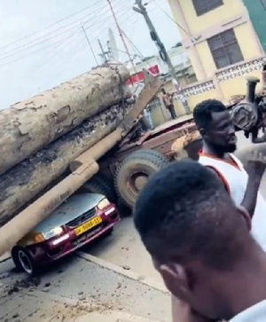 Timber from the truck fell and crushed multiple cars