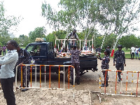 Security officers offloading barricades from a truck