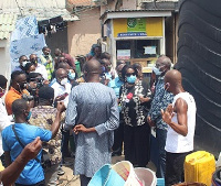 Madam Cecilia Abena Dapaah (third from right) interacting with residents of Chorkor