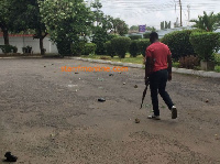 A photograph on social media of a guard carrying a gun at Akufo-Addo