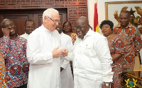 President Akufo-Addo interacting with  Rev. Father Andrew Campbell