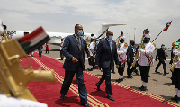 Head of Sudan's transitional govt Gen. Abdel Fattah al-Burhan (L) shakes hands with Eritrean Prez