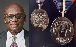 Lawyer Fui Tsikata and a copy of the National Medal