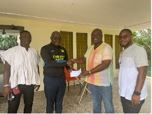 (2nd left) Ambassador Oquaye Jnr. present envelope to Osei Bonsu, Constituency chairman